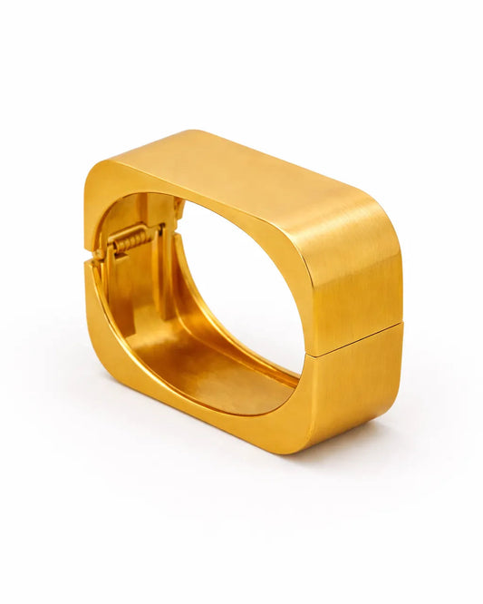 Gold hoop earring on a white background