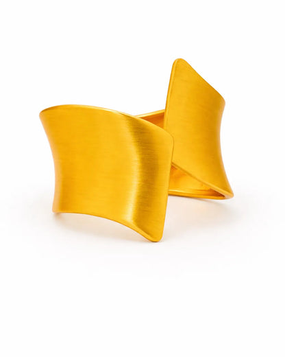 Yellow cuff bracelet on a white background