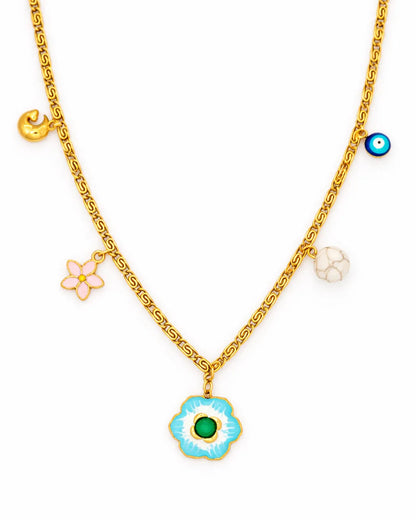 Gold necklace with various charms including a blue flower pendant on a white background