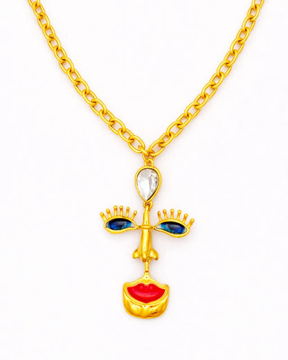 Gold necklace with a unique pendant on a white background