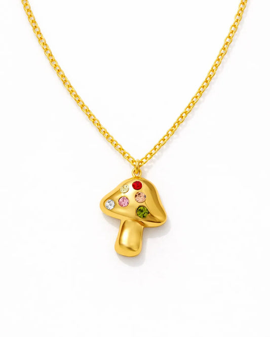 Gold necklace with a mushroom-shaped pendant on a white background