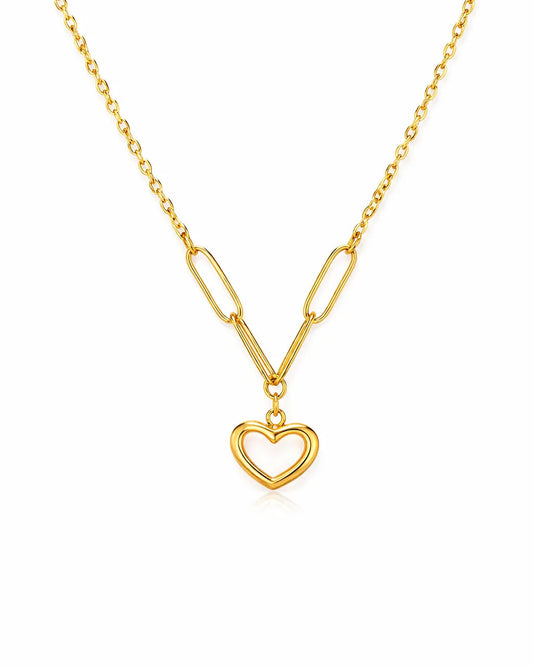 Gold necklace with a heart pendant on a white background