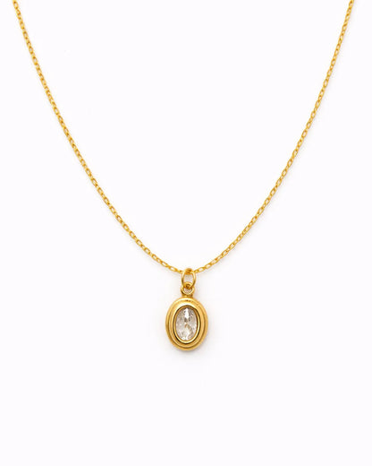 Gold necklace with a pendant on a white background