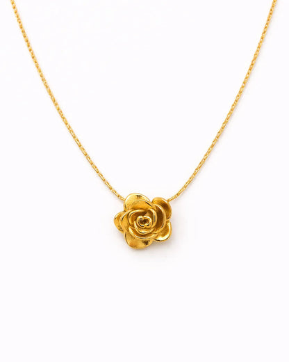 Gold rose necklace on a white background