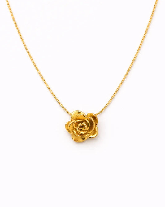 Gold rose necklace on a white background