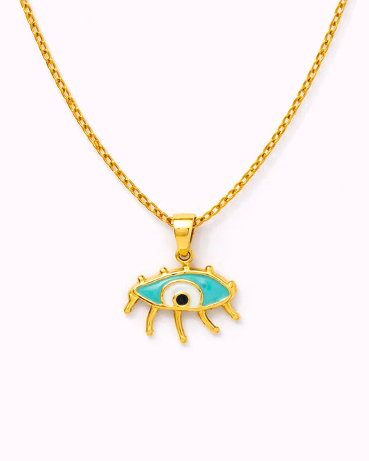 Gold necklace with an eye-shaped pendant on a white background