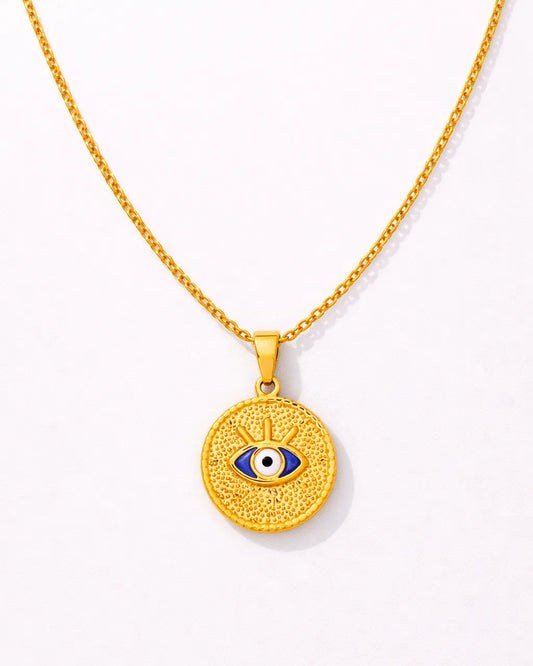 Gold necklace with an eye pendant on a white background