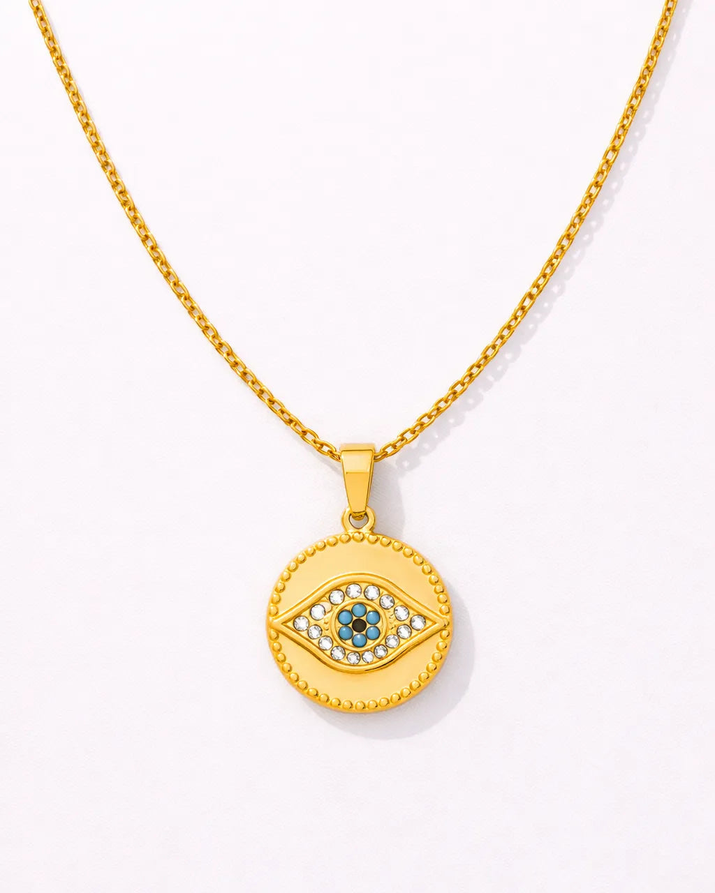 Gold necklace with an eye-shaped pendant on a white background