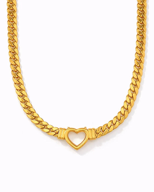 Gold chain necklace with a heart-shaped clasp on a white background