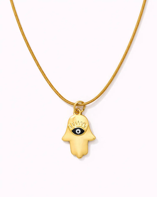 Gold necklace with a hamsa hand pendant on a white background