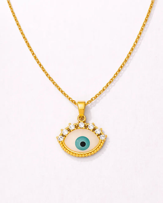 Gold necklace with an eye-shaped pendant on a white background