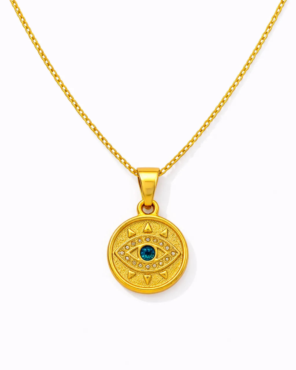 Gold necklace with a round pendant featuring a blue gemstone on a white background