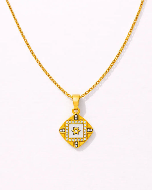 Gold necklace with a star pendant on a white background