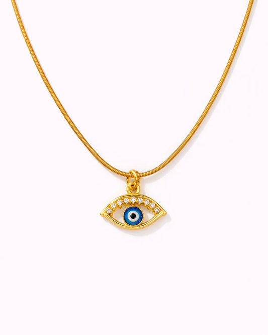 Gold necklace with an eye-shaped pendant on a white background