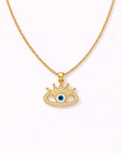 Gold necklace with an eye-shaped pendant on a white background