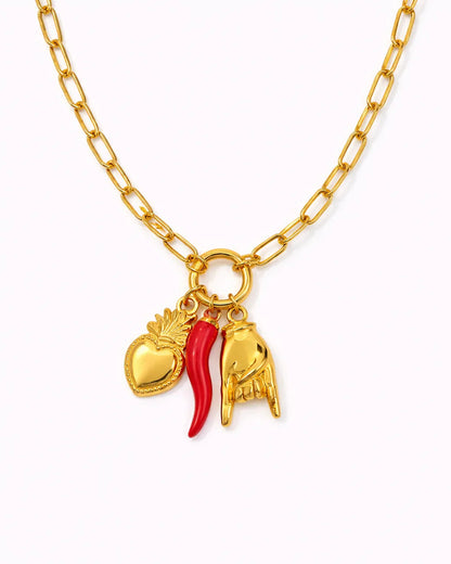 Gold necklace with heart, chili pepper, and hand charm on a white background