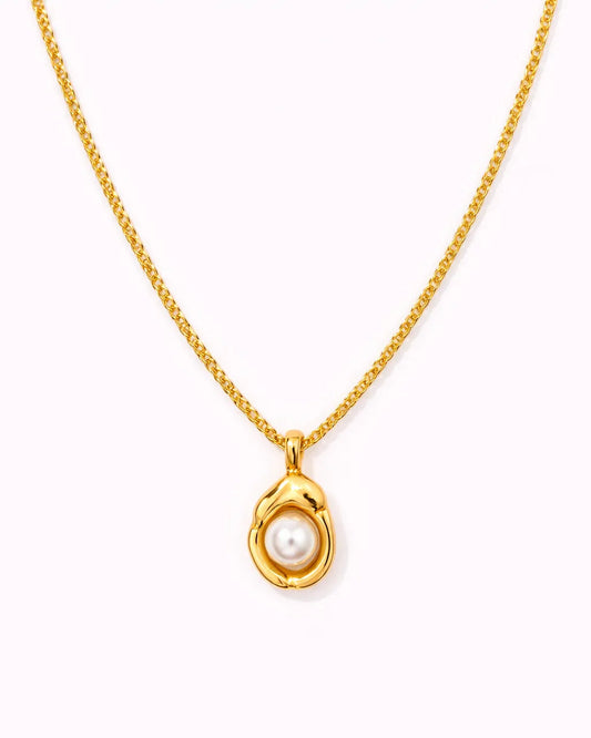 Gold necklace with a pearl pendant on a white background