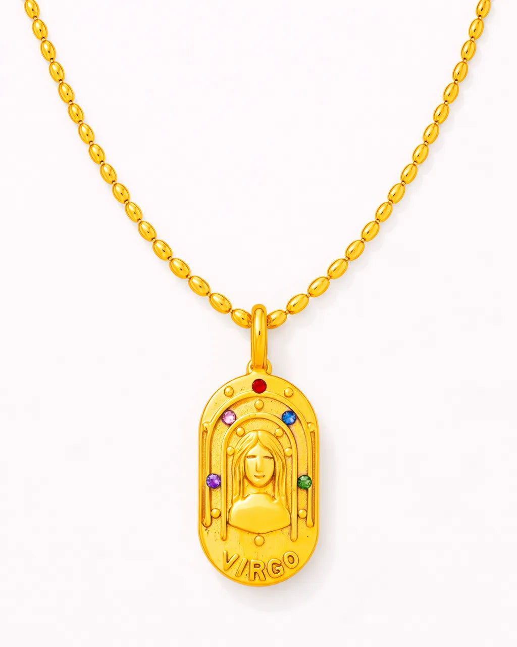 Gold pendant with colorful stones on a white background
