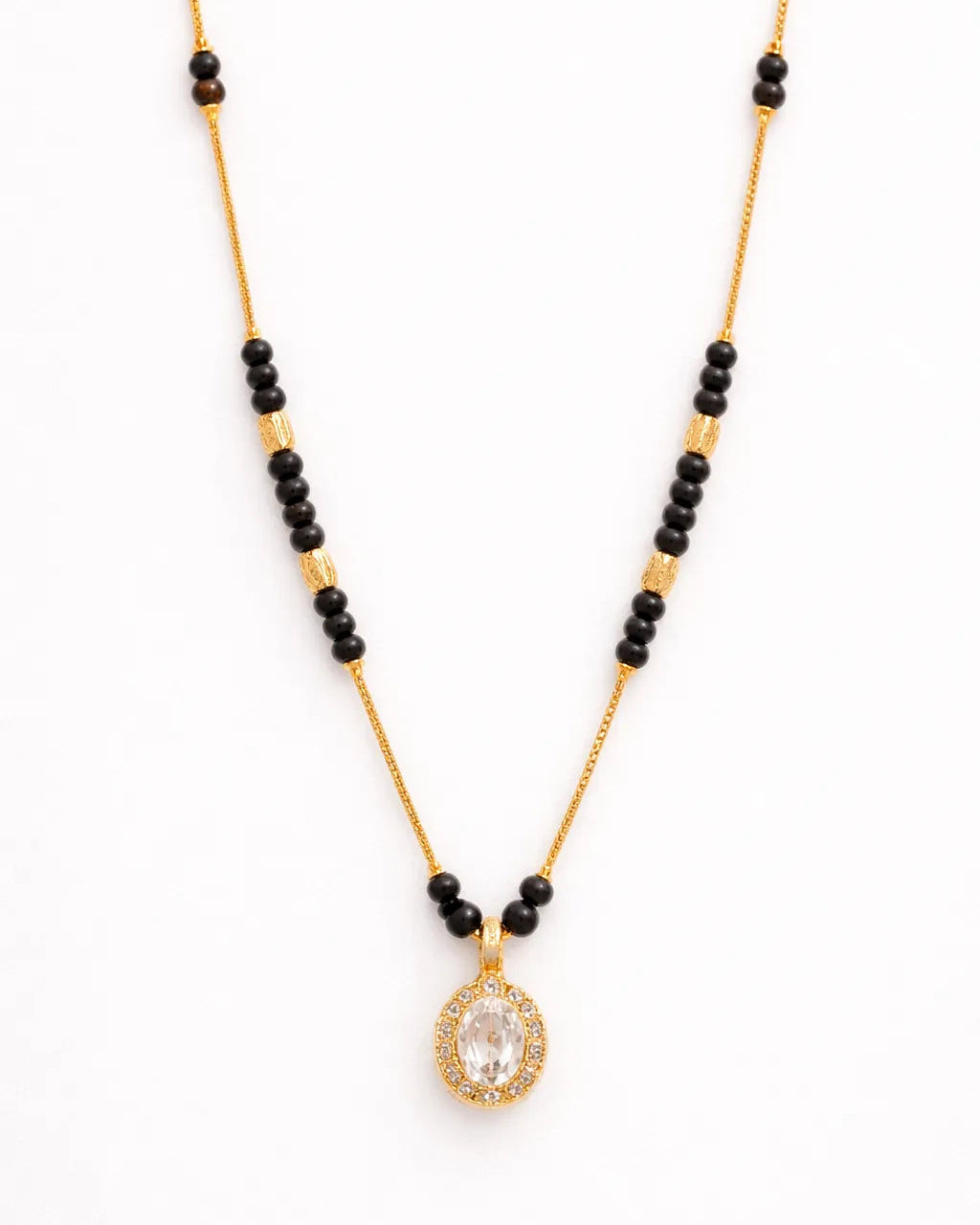 Necklace with black beads and a gold pendant on a white background
