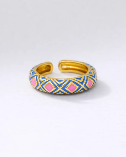 Gold and blue patterned bracelet on a white background