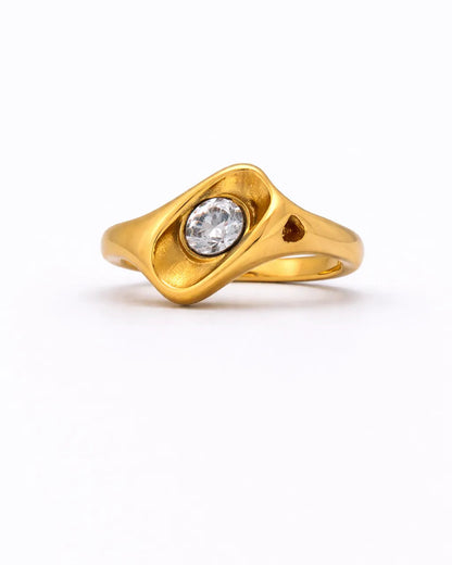 Gold ring with a diamond on a white background