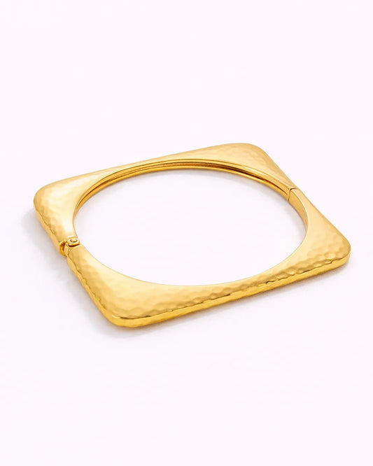 Gold bracelet on a white background