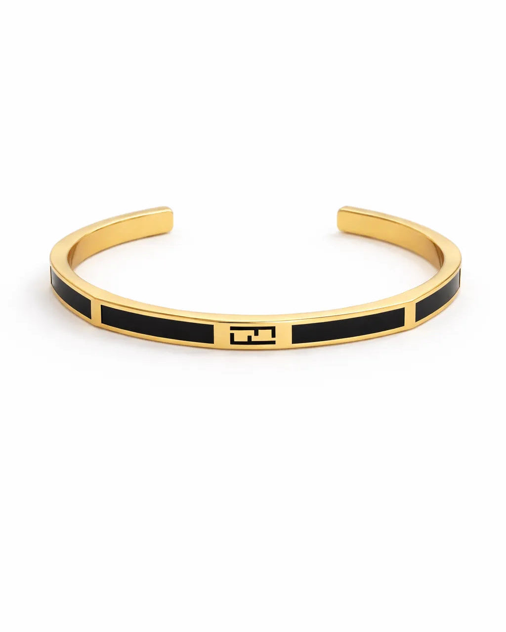 Gold and black bracelet on a white background