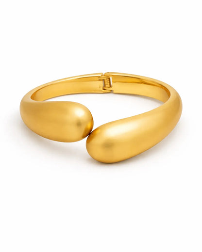 Gold bracelet on a white background
