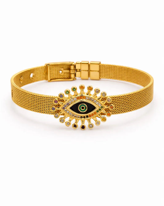 Gold bracelet with an eye design on a white background