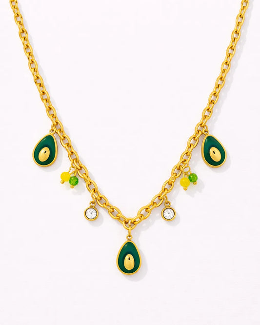 Gold necklace with green teardrop pendants on a white background
