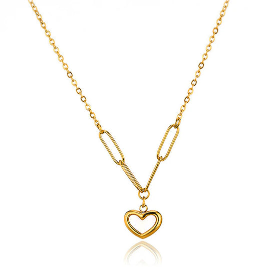 Gold necklace with a heart-shaped pendant on a white background